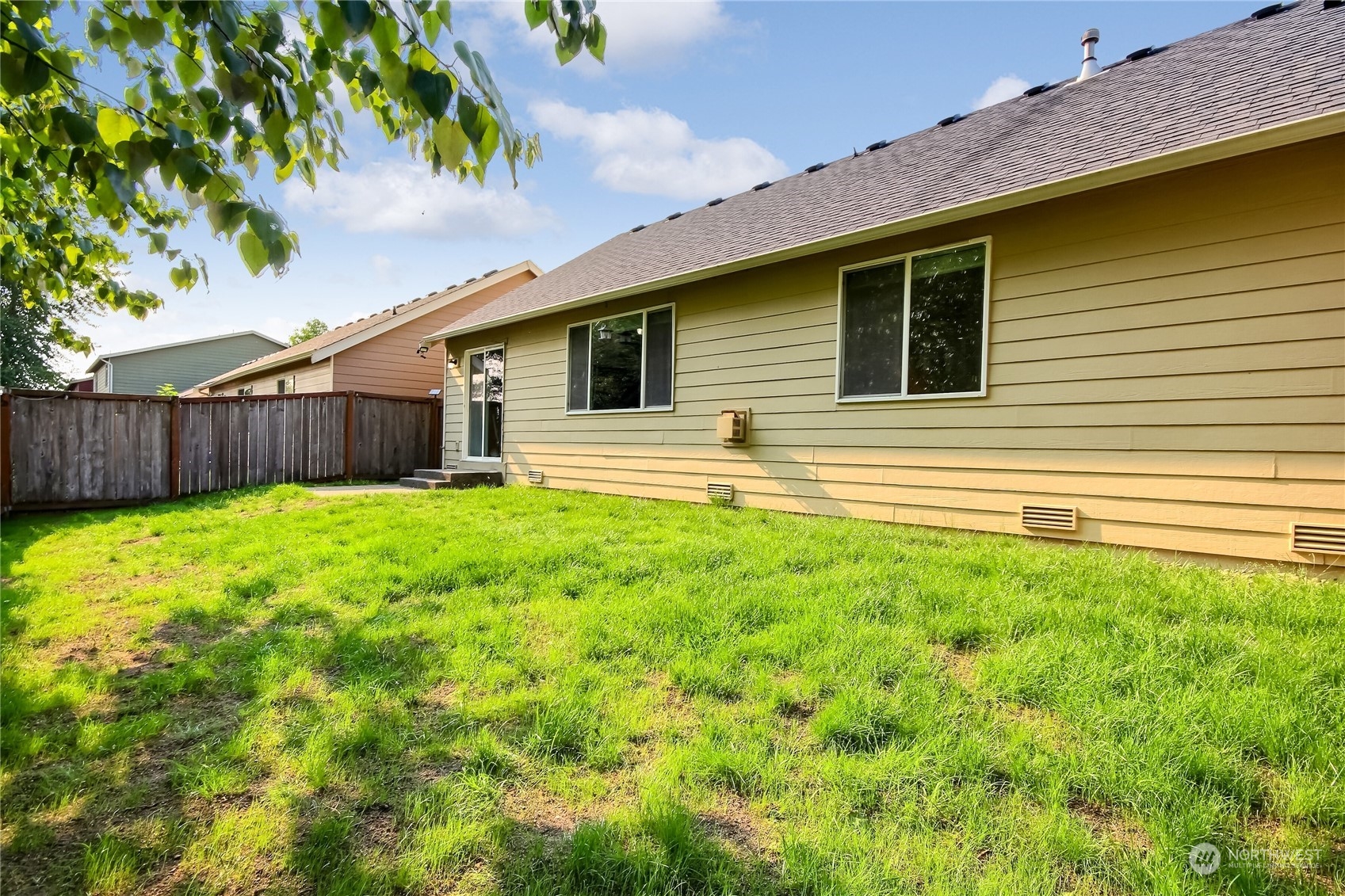 9814 201st Street East Graham, WA 98338 - Photo 26 of 40 a view of a house with a backyard