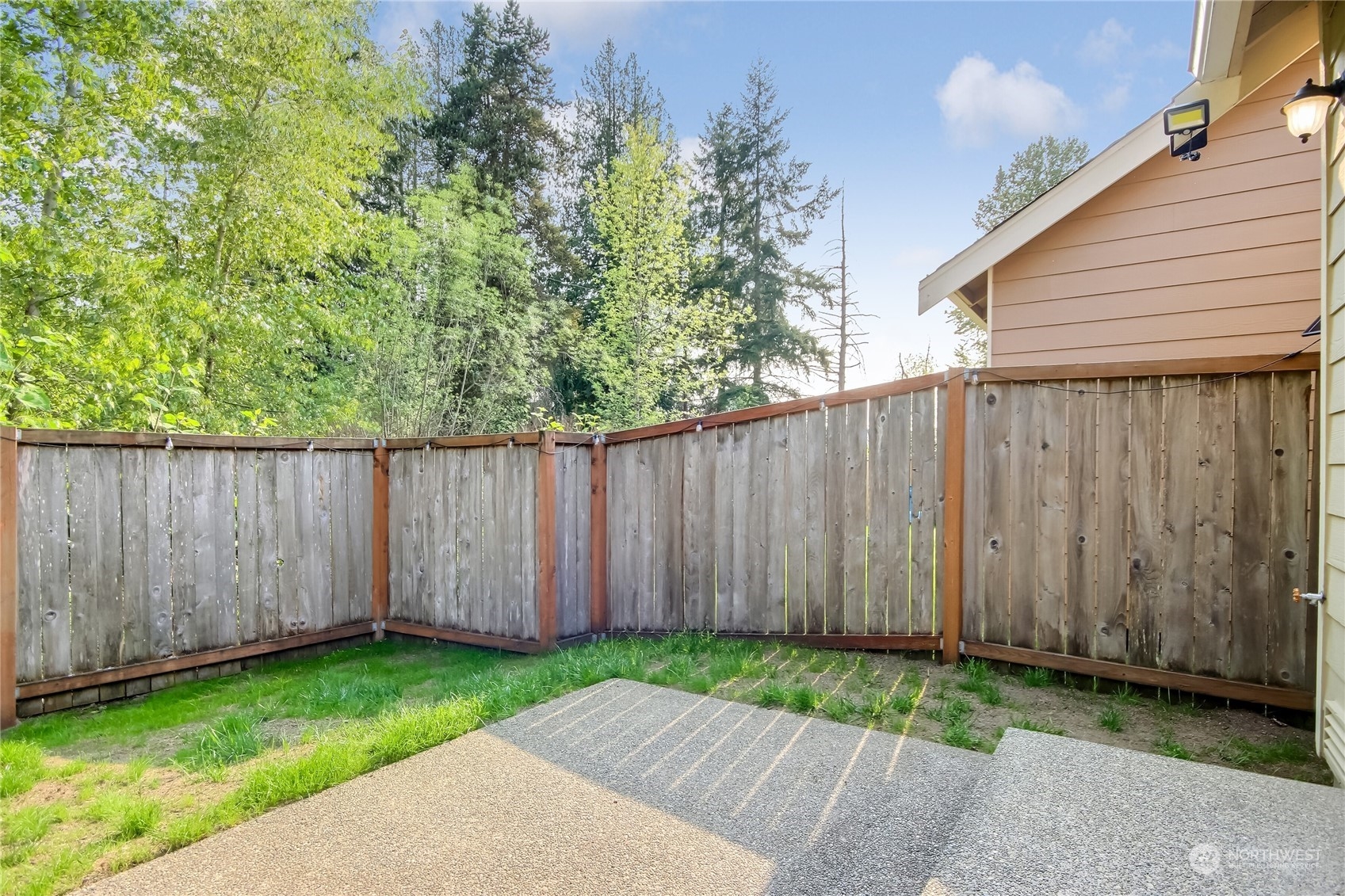 9814 201st Street East Graham, WA 98338 - Photo 29 of 40 a view of a backyard with wooden fence