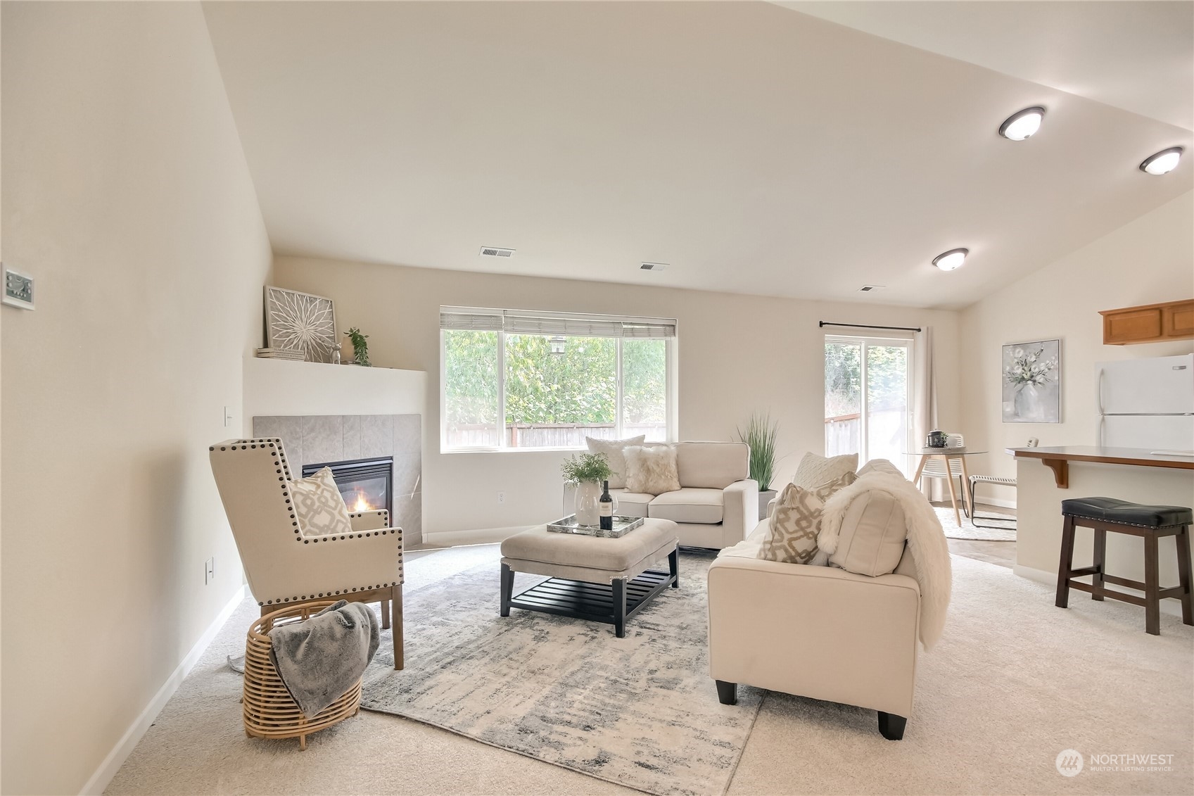 9814 201st Street East Graham, WA 98338 - Photo 3 of 40 a living room with furniture and a fireplace