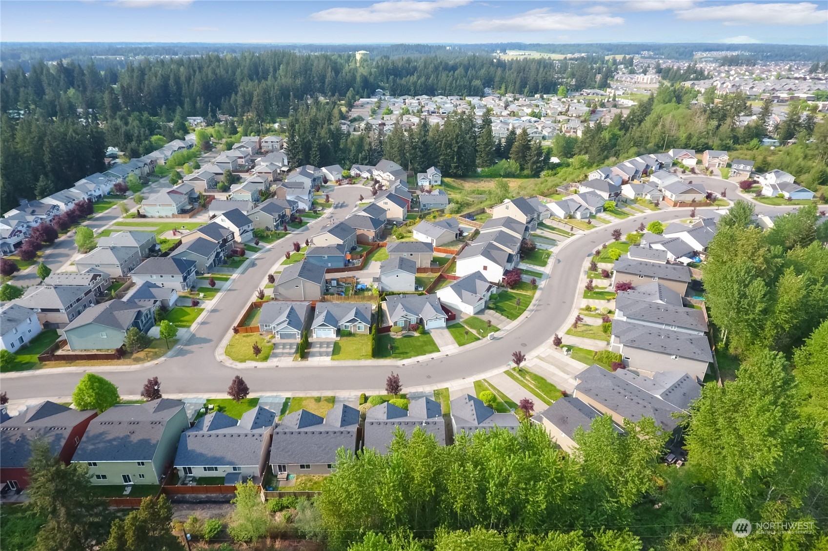 9814 201st Street East Graham, WA 98338 - Photo 33 of 40 an aerial view of a house with a swimming pool outdoor seating and yard