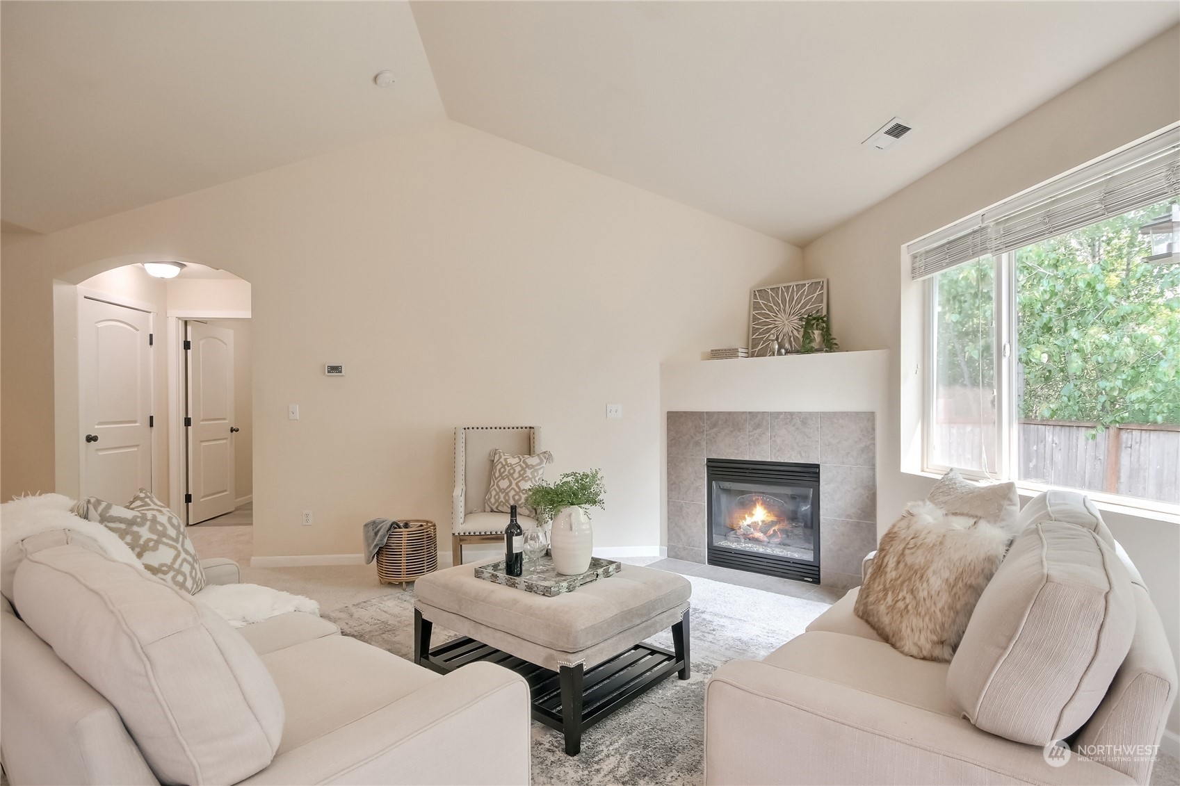 9814 201st Street East Graham, WA 98338 - Photo 4 of 40 a living room with furniture and a fireplace