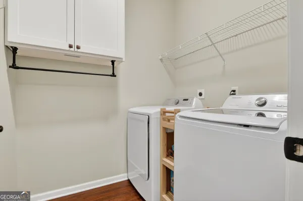 a utility room with dryer and washer