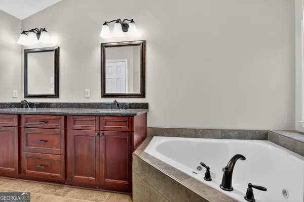 a bathroom with a bathtub and a sink