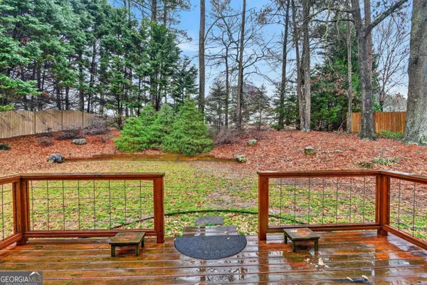 a view of a backyard with sitting area