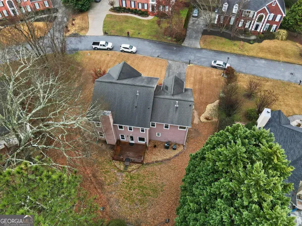 a view of swimming pool with a house in the background