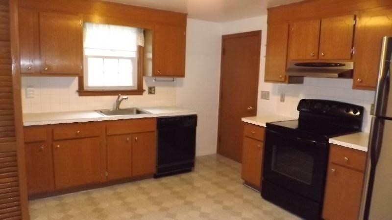 94 Walnut Street, Unit 2 Belmont, MA 02478 - Photo 2 of 7 a kitchen with a sink and cabinets