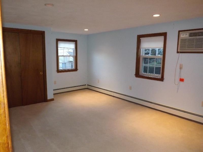 94 Walnut Street, Unit 2 Belmont, MA 02478 - Photo 6 of 7 en empty room with windows
