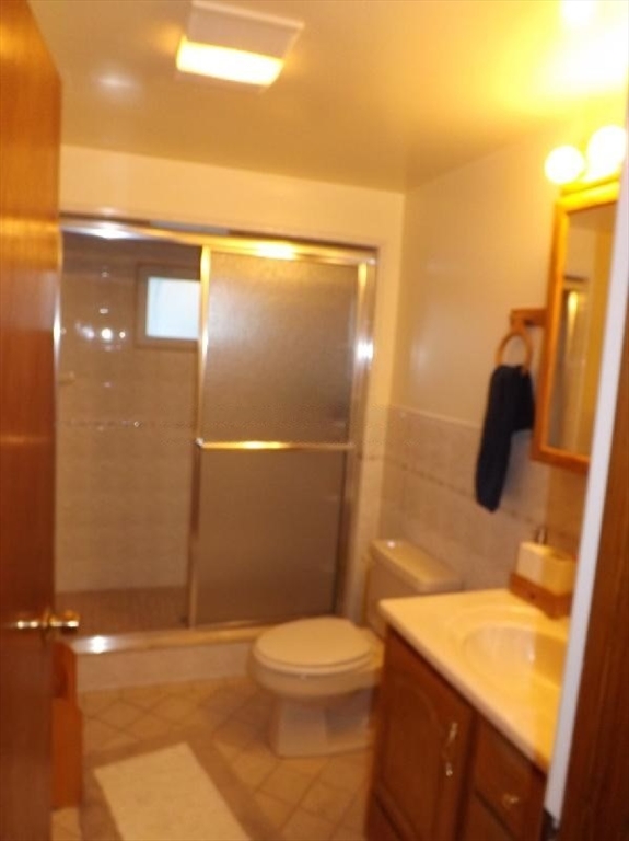 94 Walnut Street, Unit 2 Belmont, MA 02478 - Photo 7 of 7 a bathroom with a toilet and a shower