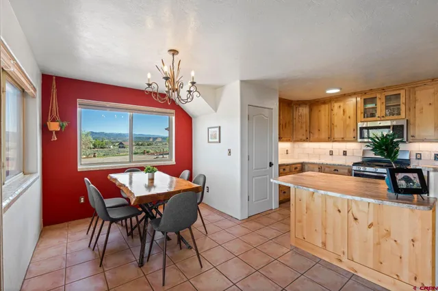 a view of a dining room with furniture window and outside view