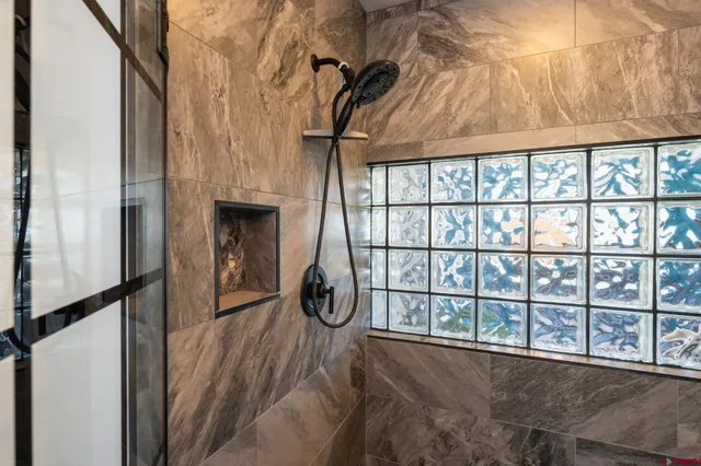 a view of a livingroom with furniture and entryway