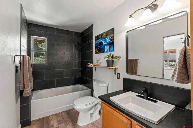 a bedroom with furniture and a window