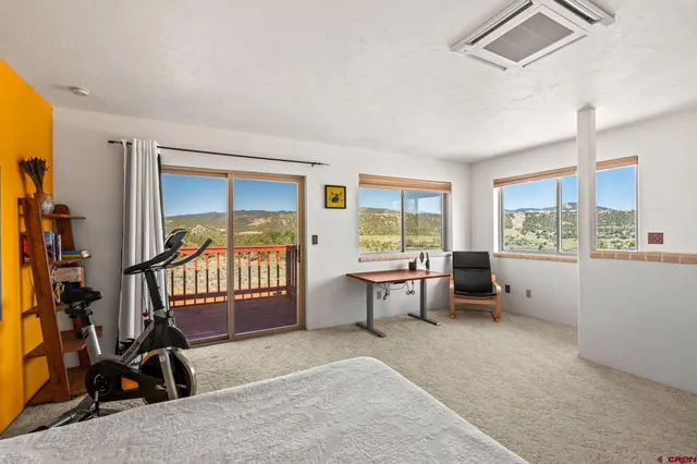 a bedroom with a bed and dresser