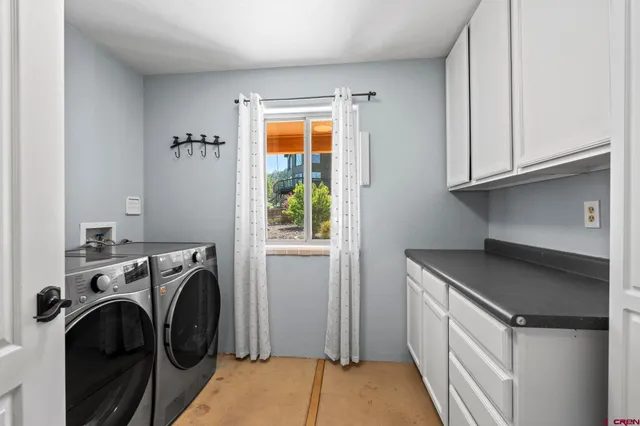 a roof deck with a table and chairs