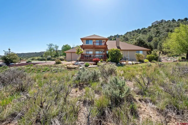 a view of a city with mountains in the background