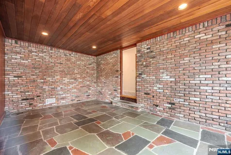 a view of a patio with a glass door