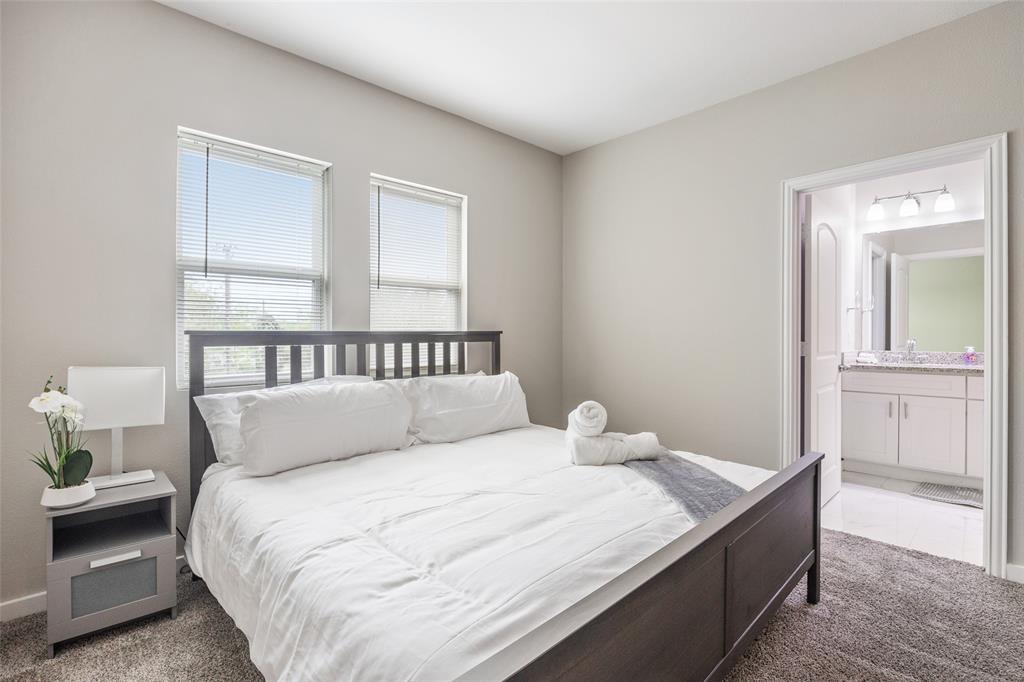 5004 Colonial Avenue Dallas, TX 75215 - Photo 16 of 20 a bedroom with a bed and a window