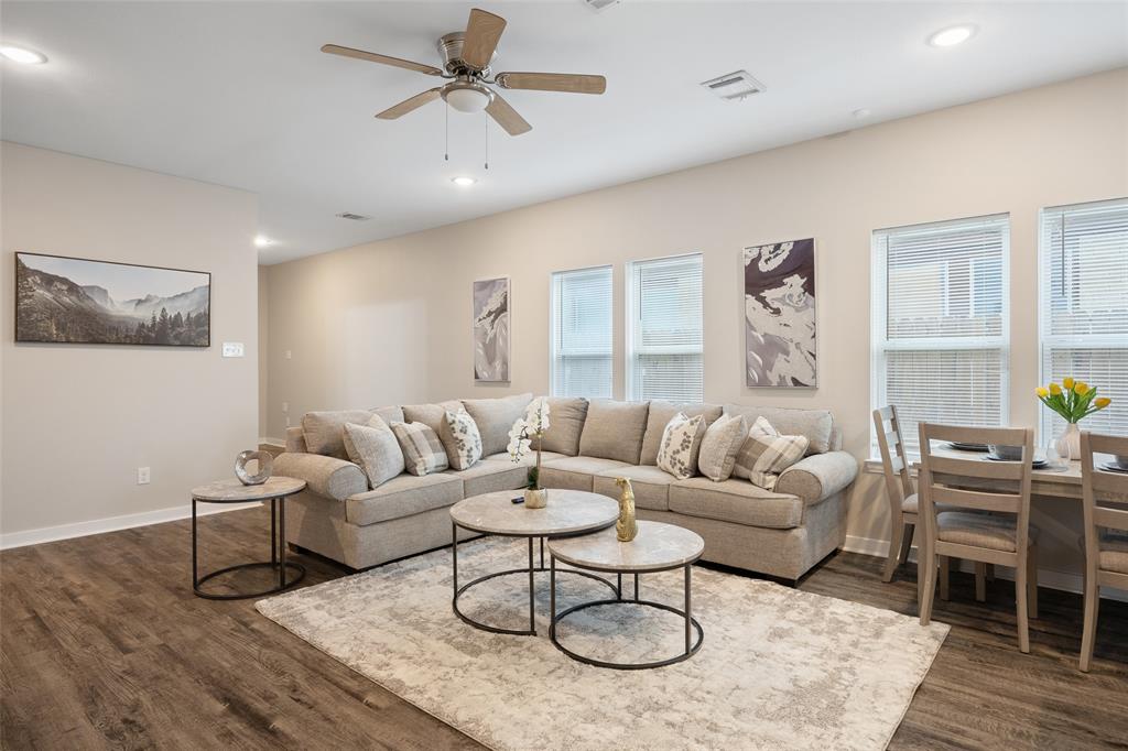 5004 Colonial Avenue Dallas, TX 75215 - Photo 3 of 20 a living room with furniture and a wooden floor