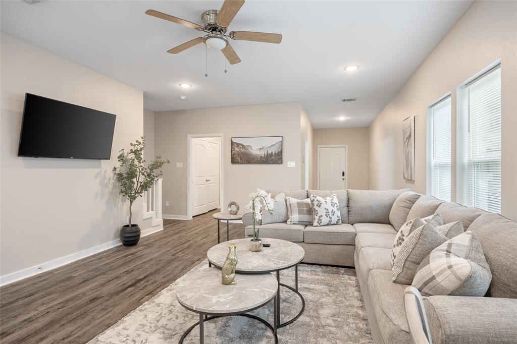 5004 Colonial Avenue Dallas, TX 75215 - Photo 5 of 20 a living room with furniture and a flat screen tv