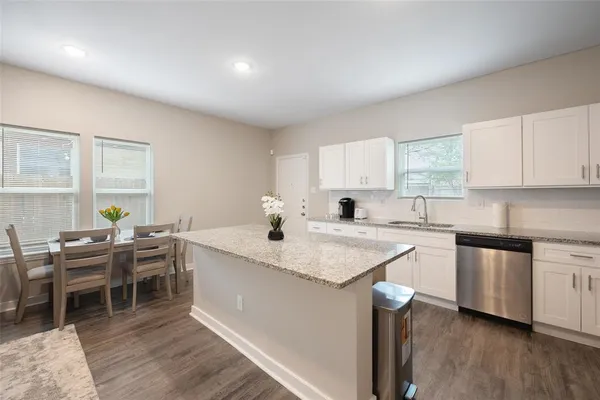 a kitchen with a sink and cabinets