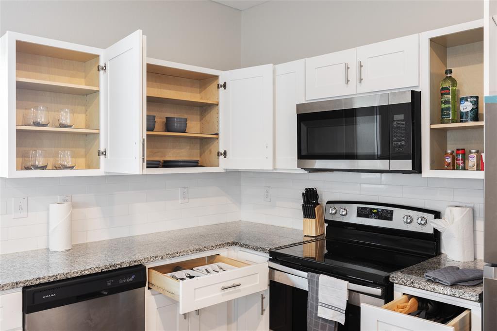 5004 Colonial Avenue Dallas, TX 75215 - Photo 8 of 20 a kitchen with cabinets and appliances
