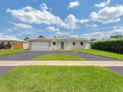 a view of a yard in front of a house