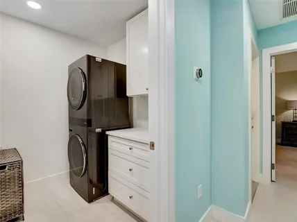 a bedroom with a bed and a mirror