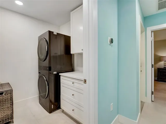 a bedroom with a bed and a mirror