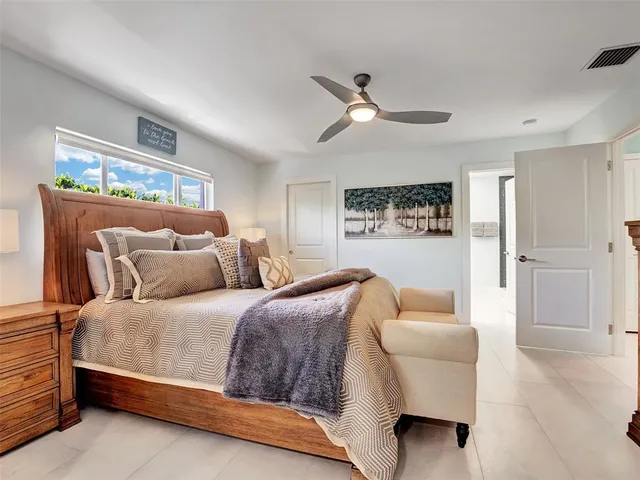 a bedroom with a bed and a couch