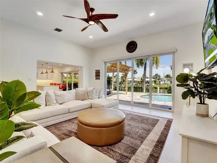 a living room with furniture and a large window