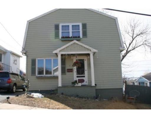 5 Garland Street Everett, MA 02149 - Photo 1 of 17 a front view of a house with a yard