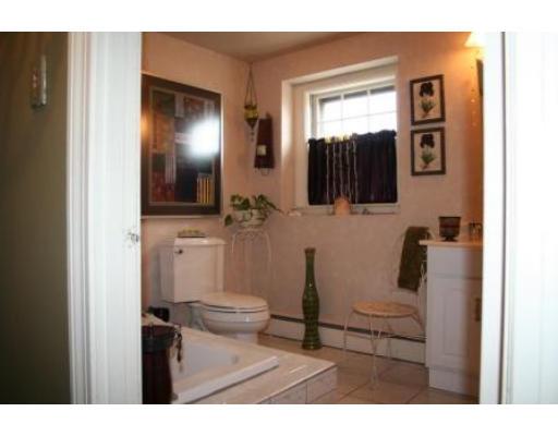 5 Garland Street Everett, MA 02149 - Photo 12 of 17 a bathroom with a sink a toilet and mirror