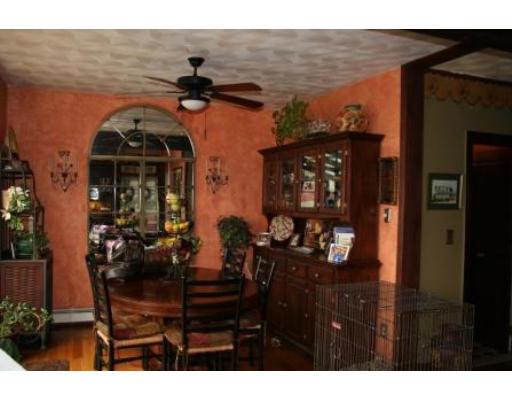 5 Garland Street Everett, MA 02149 - Photo 6 of 17 a view of a porch with dining table and chairs