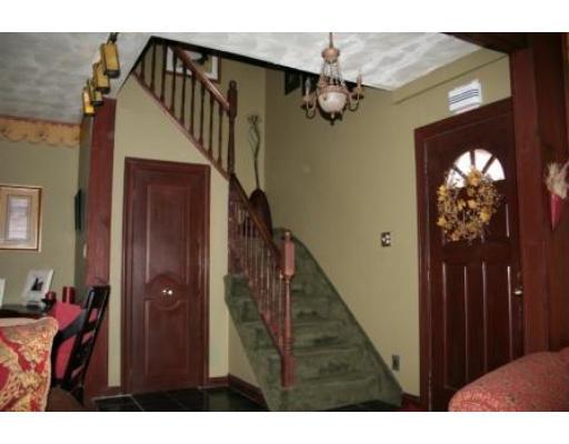 5 Garland Street Everett, MA 02149 - Photo 10 of 17 a view of a livingroom and stairs