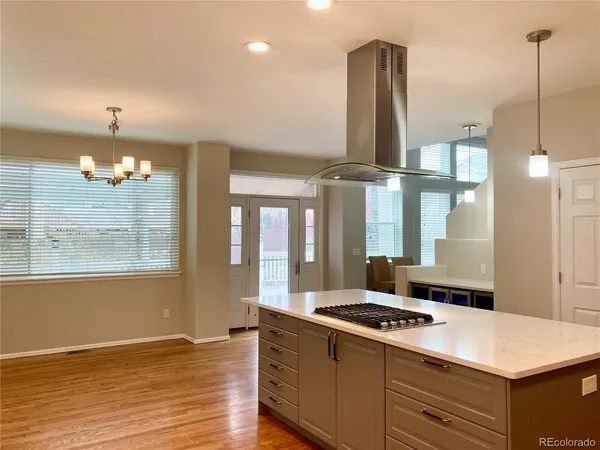 a kitchen with a stove and a refrigerator
