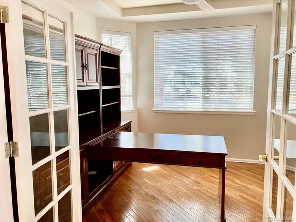 a view of room with window and wooden floor