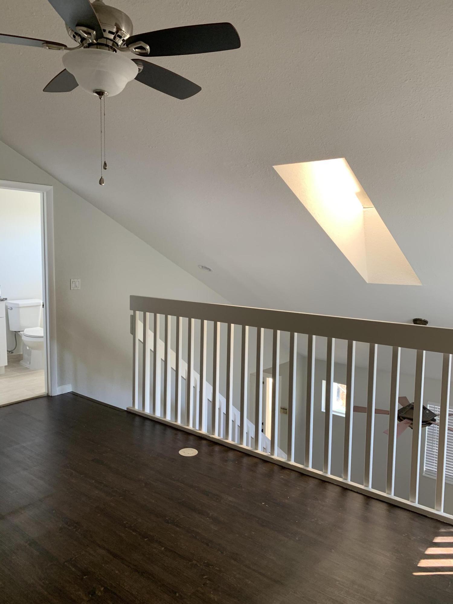 320 Southeast 2nd Avenue, Unit B1 Deerfield Beach, FL 33441 - Photo 17 of 22 a view of an empty room with wooden floor