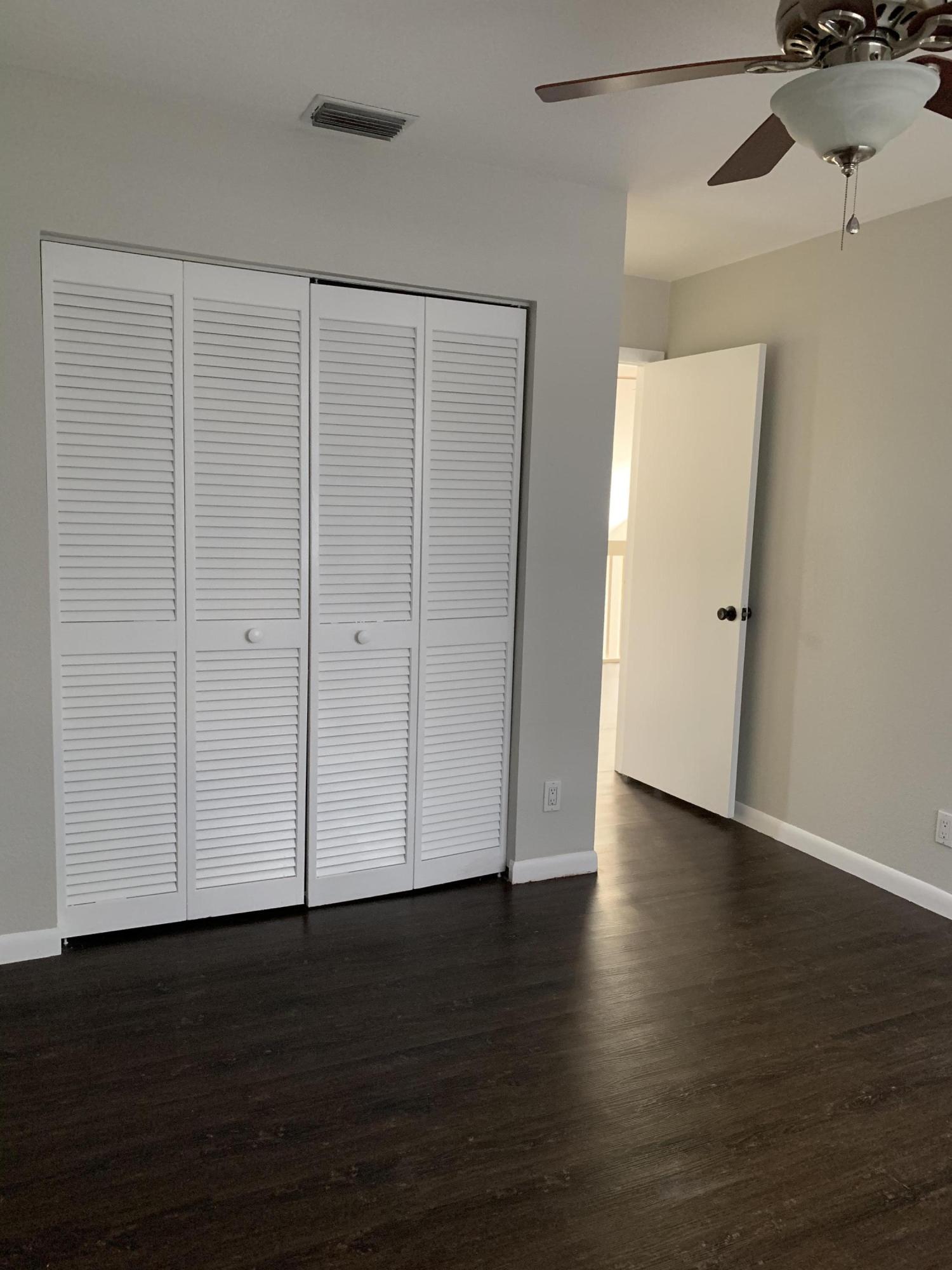 320 Southeast 2nd Avenue, Unit B1 Deerfield Beach, FL 33441 - Photo 20 of 22 a view of an empty room with wooden floor