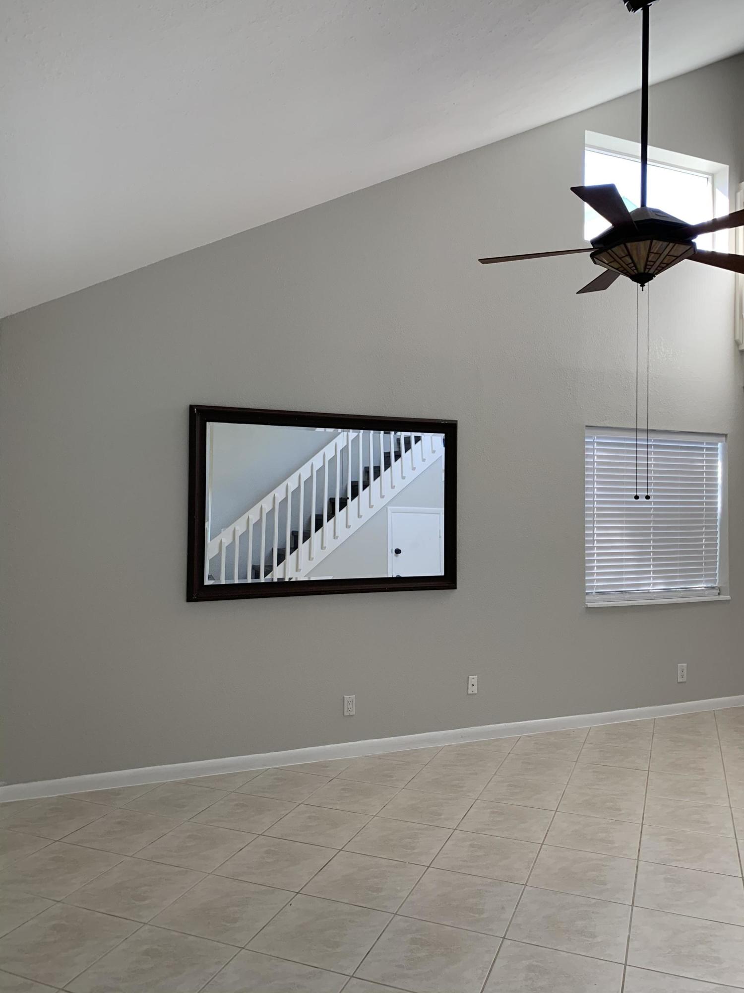 320 Southeast 2nd Avenue, Unit B1 Deerfield Beach, FL 33441 - Photo 2 of 22 a view of a hallway with a window