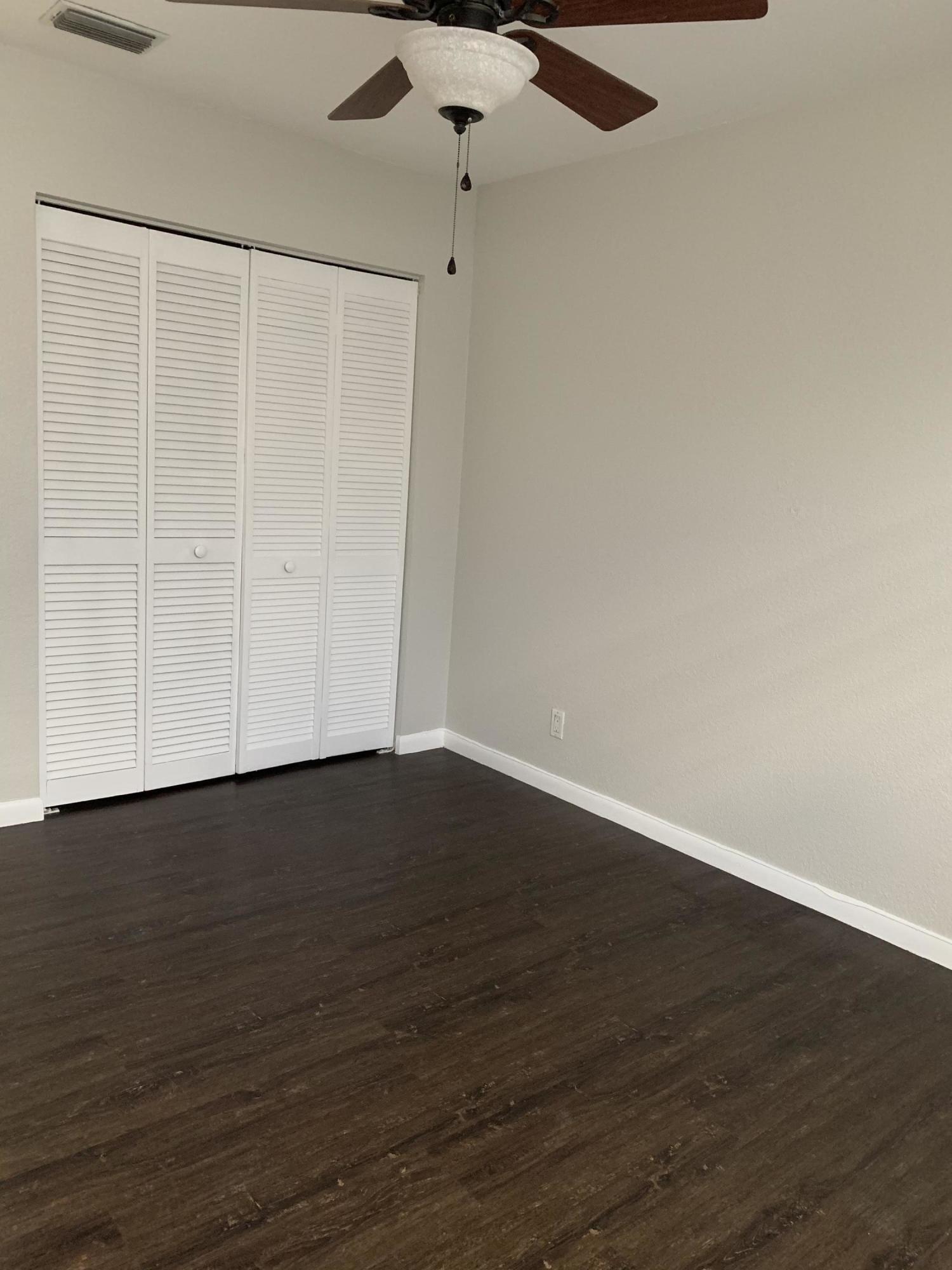 320 Southeast 2nd Avenue, Unit B1 Deerfield Beach, FL 33441 - Photo 21 of 22 a view of an empty room with wooden floor