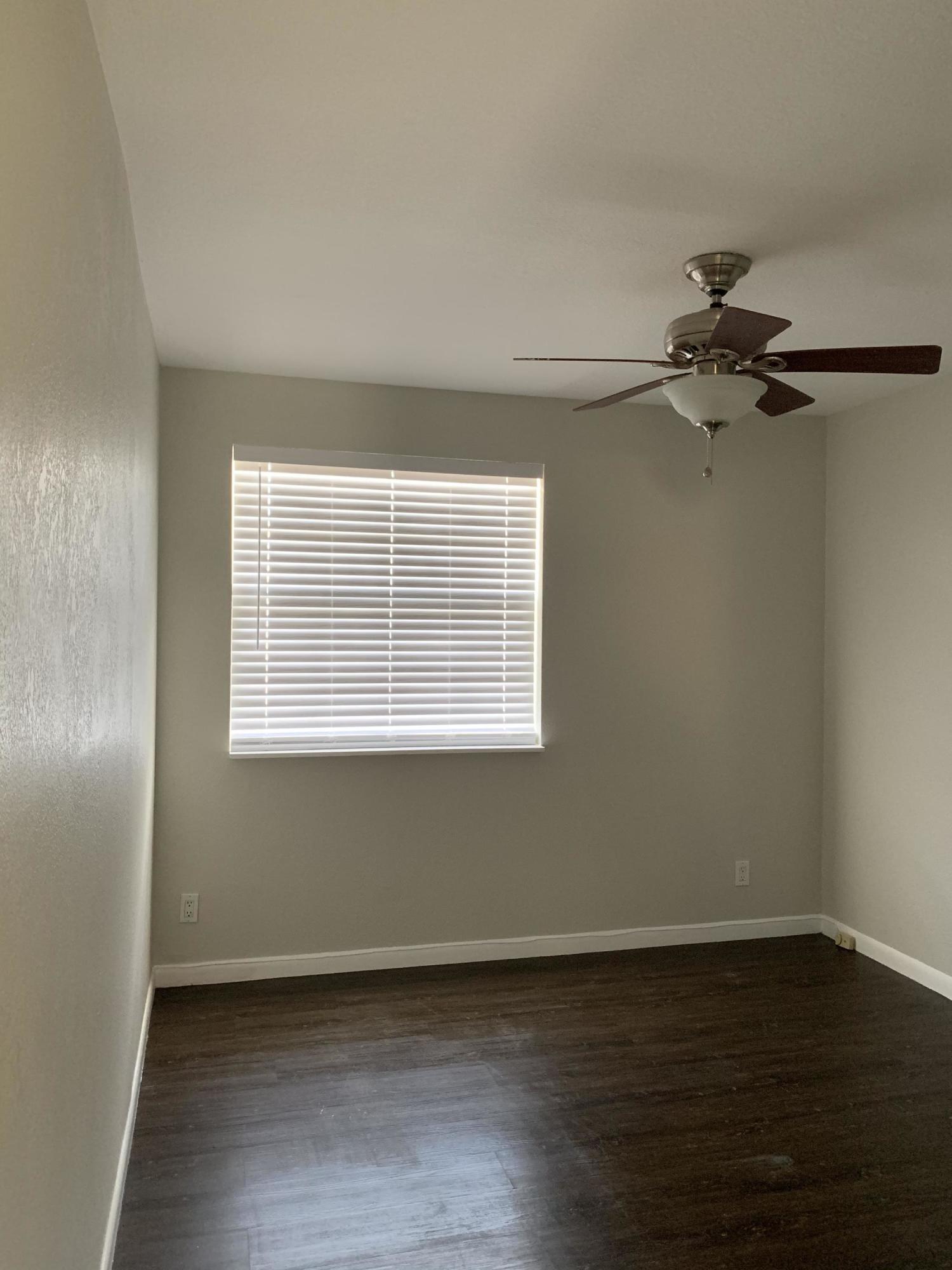 320 Southeast 2nd Avenue, Unit B1 Deerfield Beach, FL 33441 - Photo 22 of 22 wooden floor in an empty room with a window