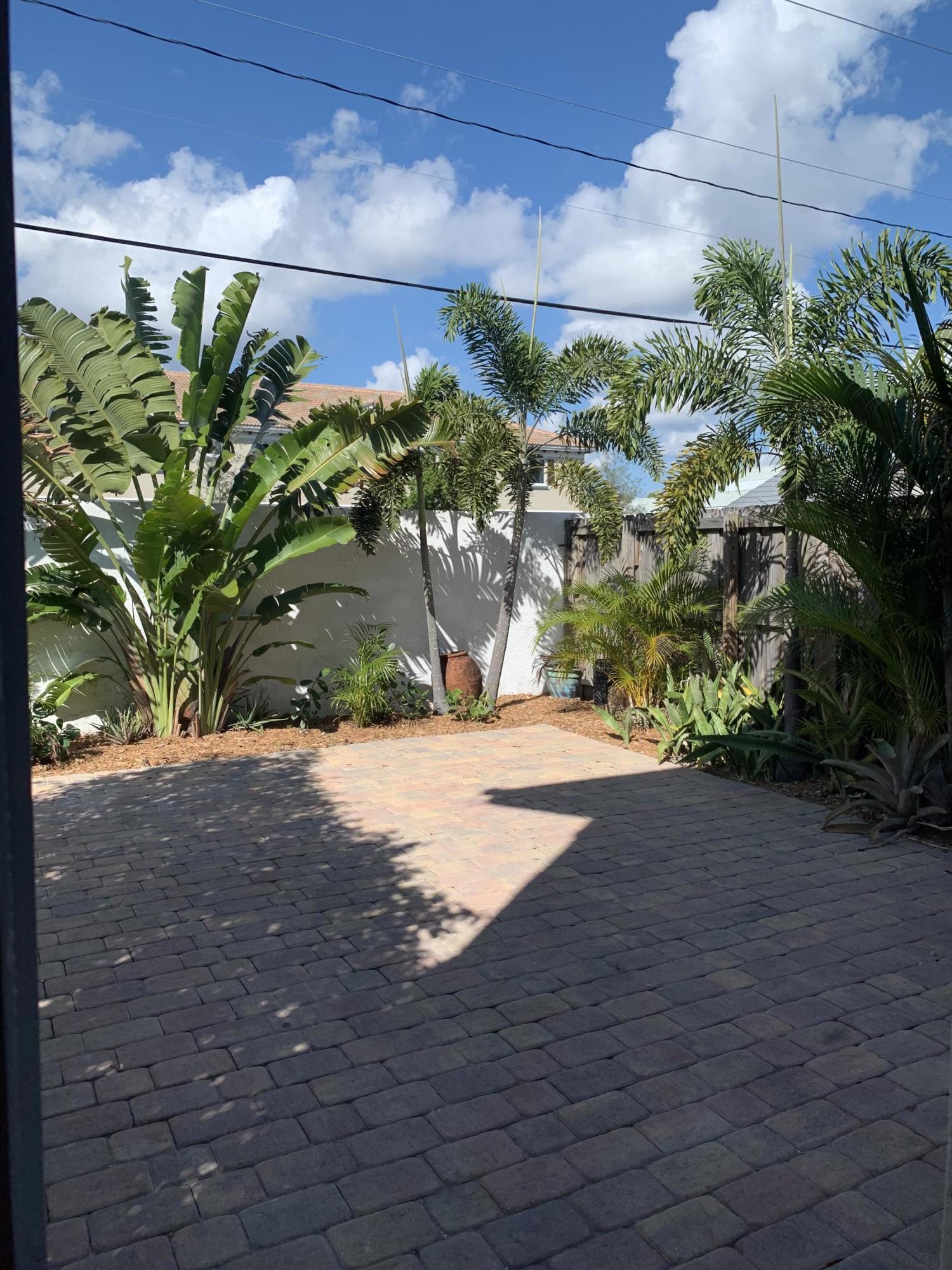 320 Southeast 2nd Avenue, Unit B1 Deerfield Beach, FL 33441 - Photo 5 of 22 a view of a yard with plants