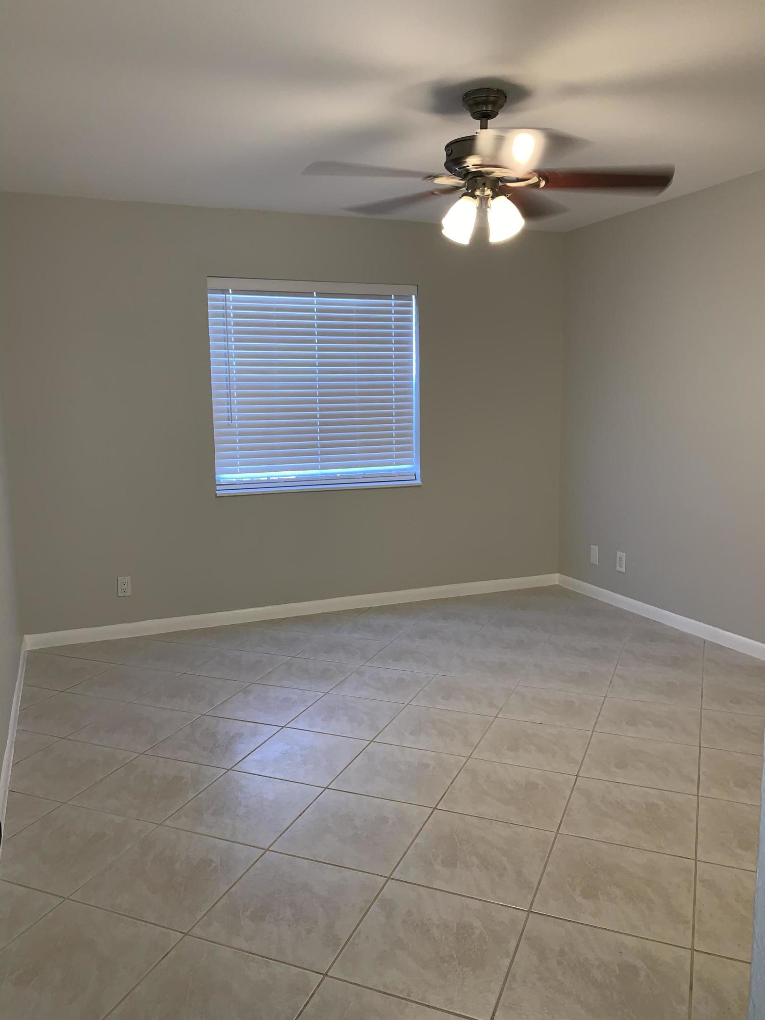 320 Southeast 2nd Avenue, Unit B1 Deerfield Beach, FL 33441 - Photo 9 of 22 a view of an empty room with a window
