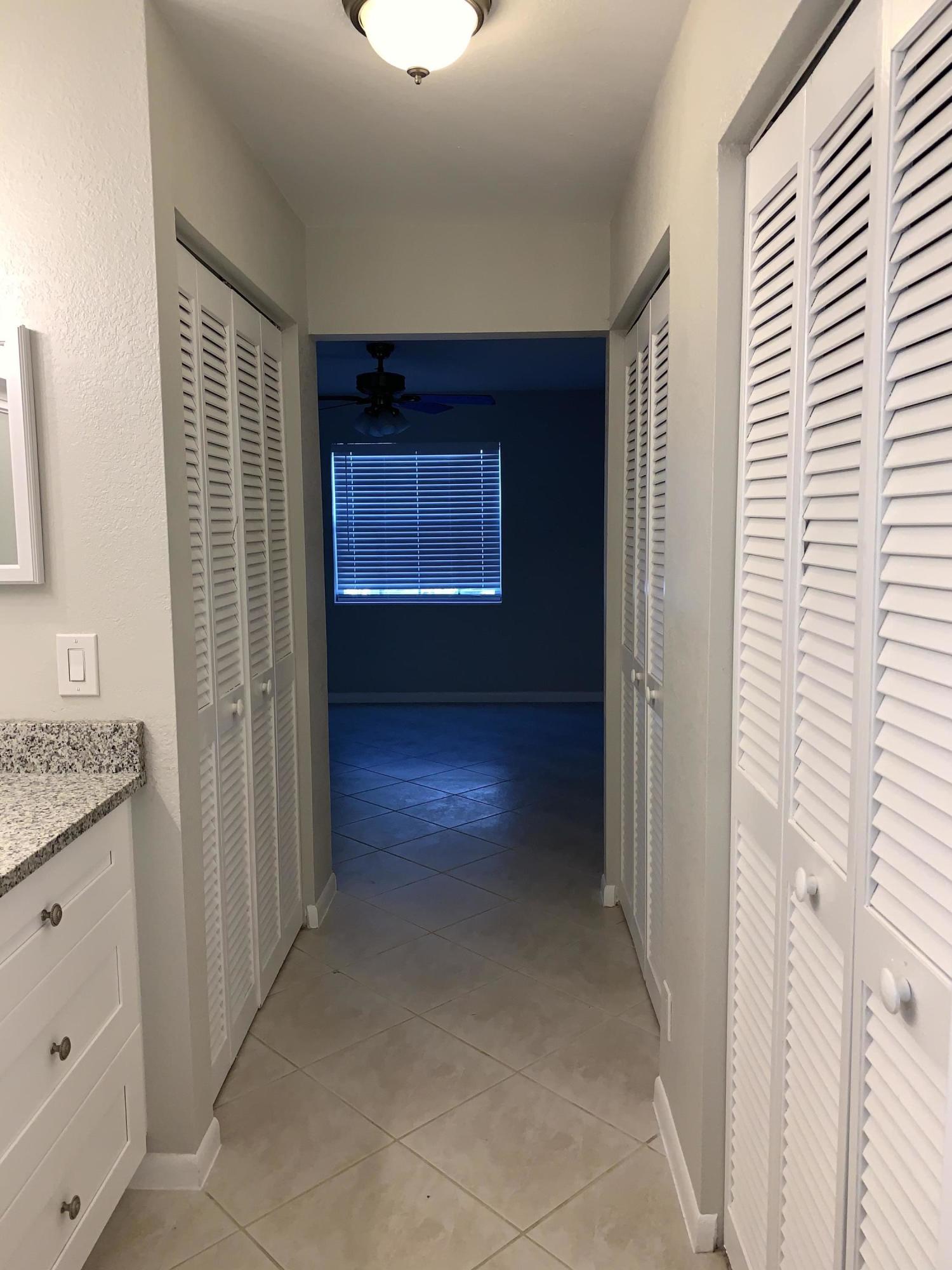 320 Southeast 2nd Avenue, Unit B1 Deerfield Beach, FL 33441 - Photo 10 of 22 a view of hallway with a bathroom and a sink