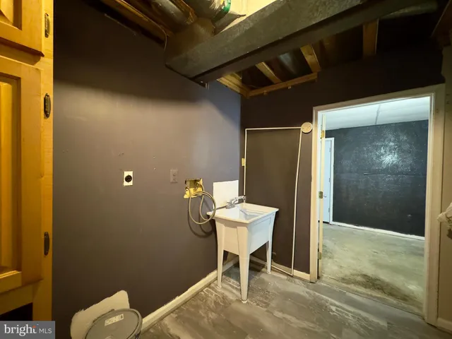 a workspace room with a wooden table and chair