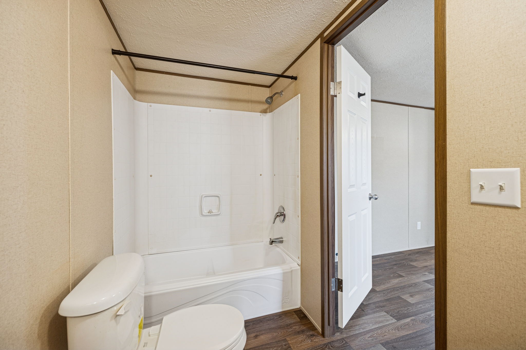 108 Lyell Road Hohenwald, TN 38462 - Photo 13 of 28 a bathroom with a shower a toilet and a glass door