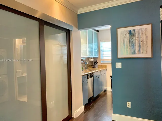 a kitchen with stainless steel appliances granite countertop a refrigerator and a stove