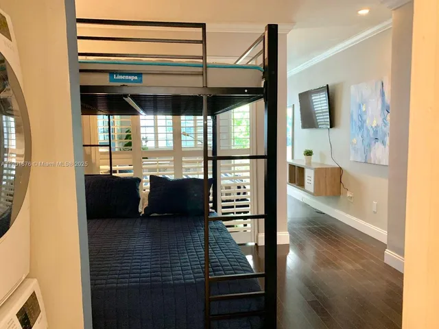 a view of a living room with a flat screen tv