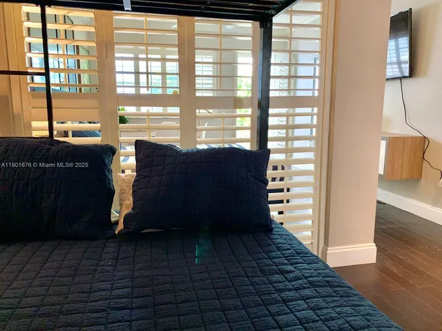 a view of a living room and a window
