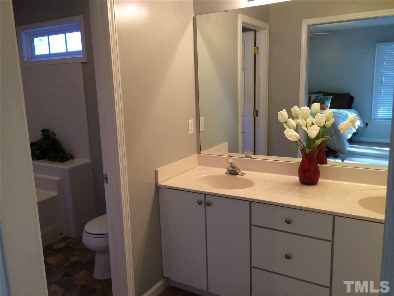 515 Windcrest Road Durham, NC 27713 - Photo 11 of 15 Double vanity in master bath is separate from tub/toilet area.