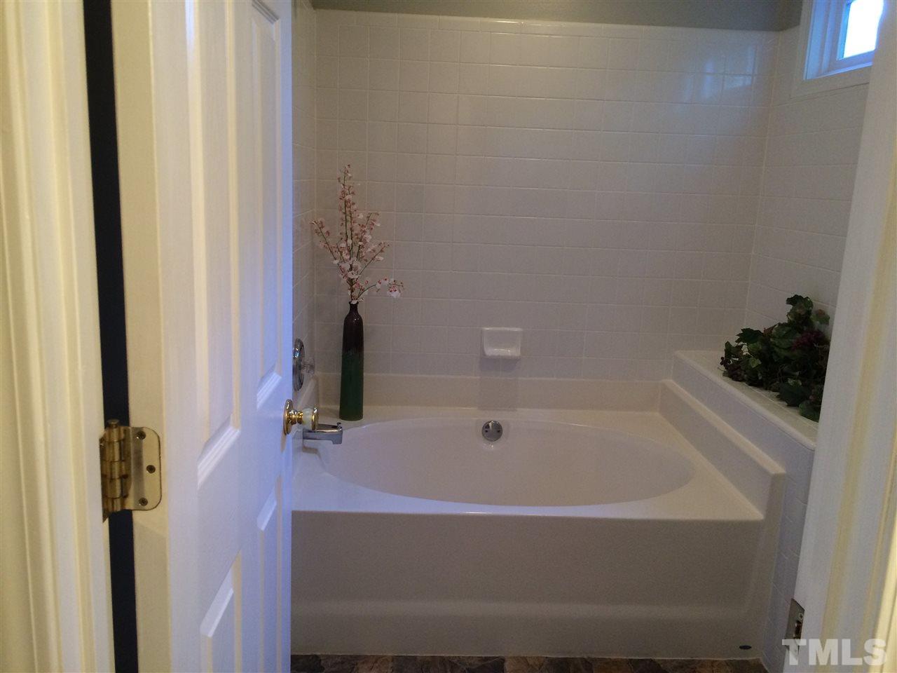 515 Windcrest Road Durham, NC 27713 - Photo 13 of 15 Sunlight streams through the transom window as you relax in the garden tub.